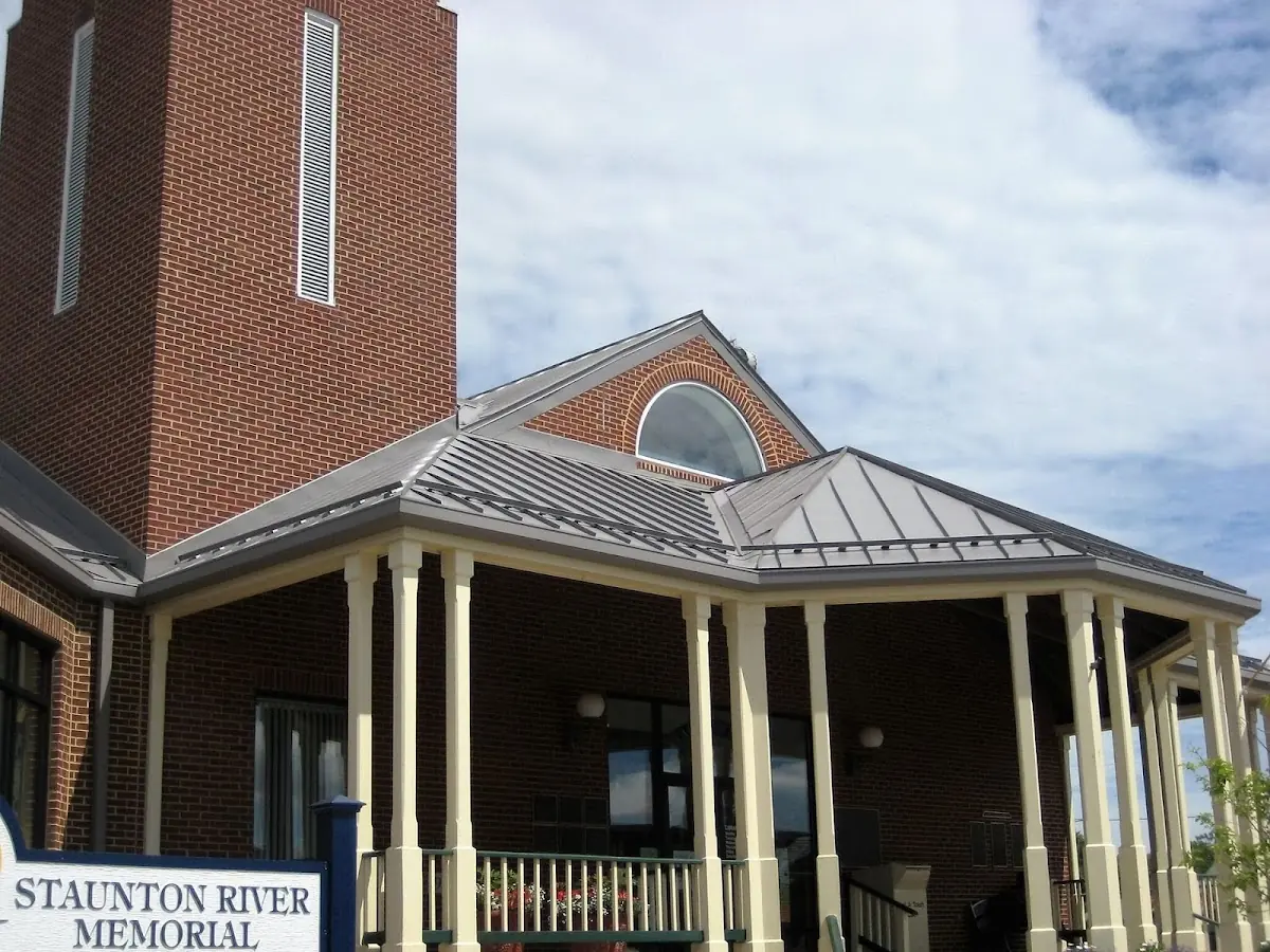 Skilled roofing craftsmen working on a residential roof in Chatham